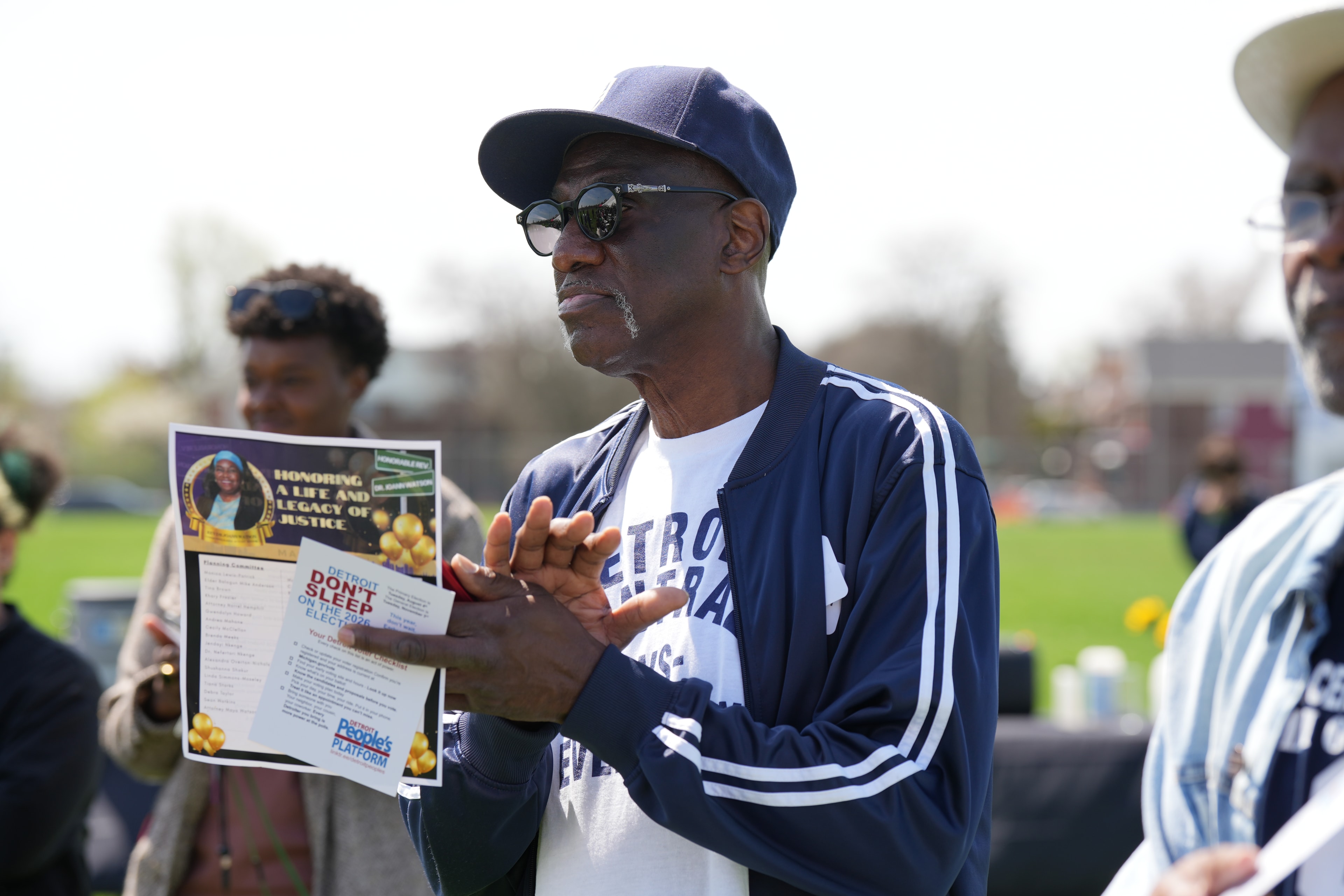 Man speaking at community outdoor event