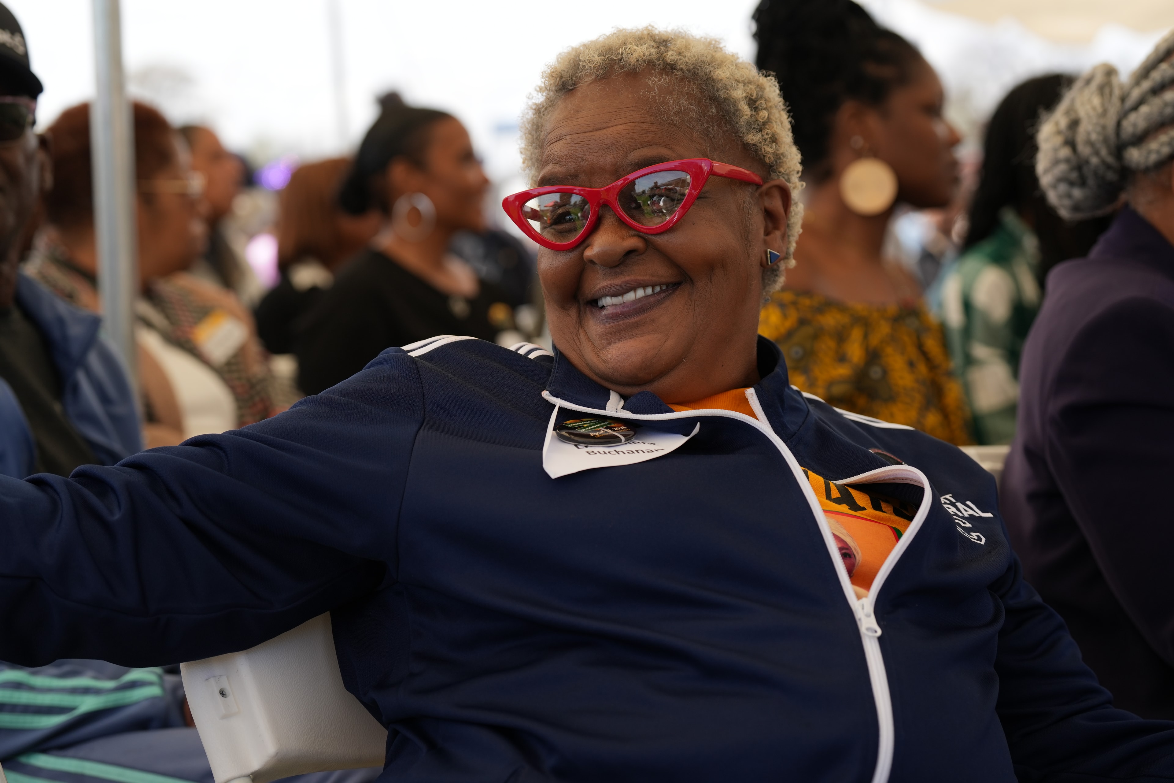 Woman wearing heart shaped sunglasses at party