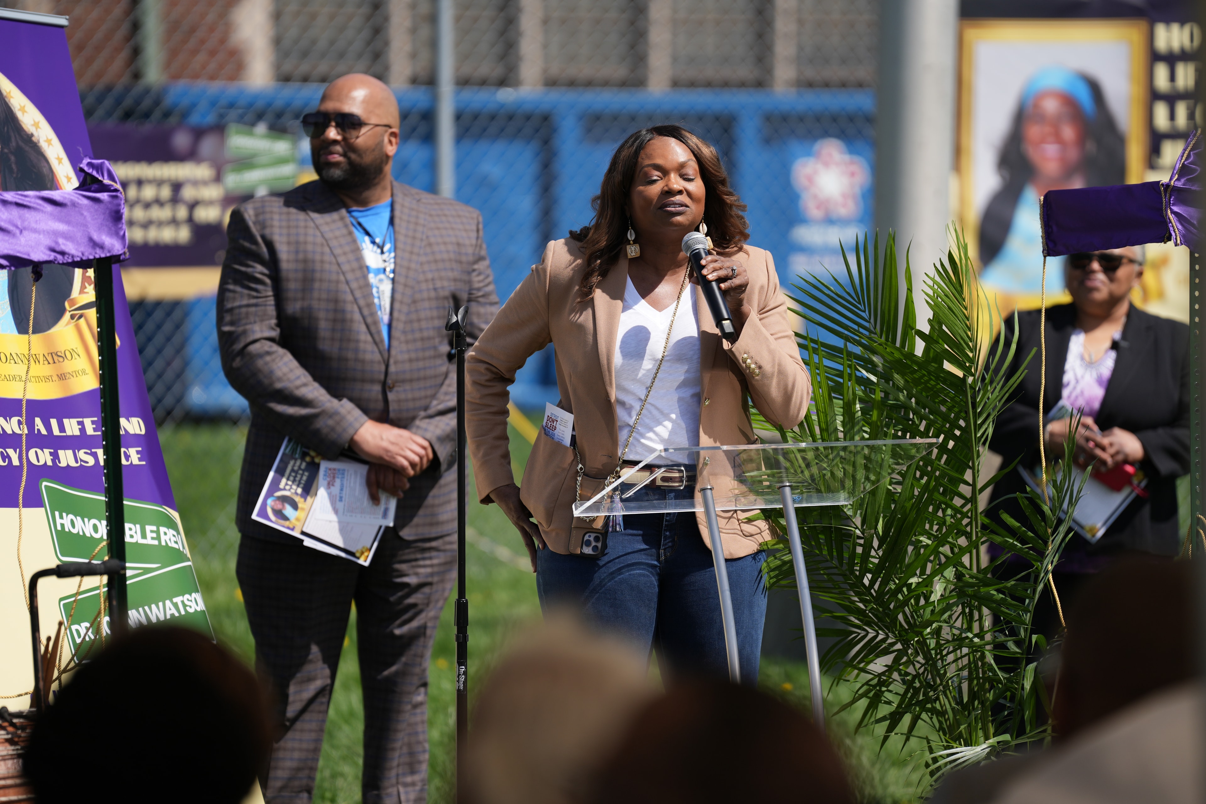 Woman speaking at outdoor community event