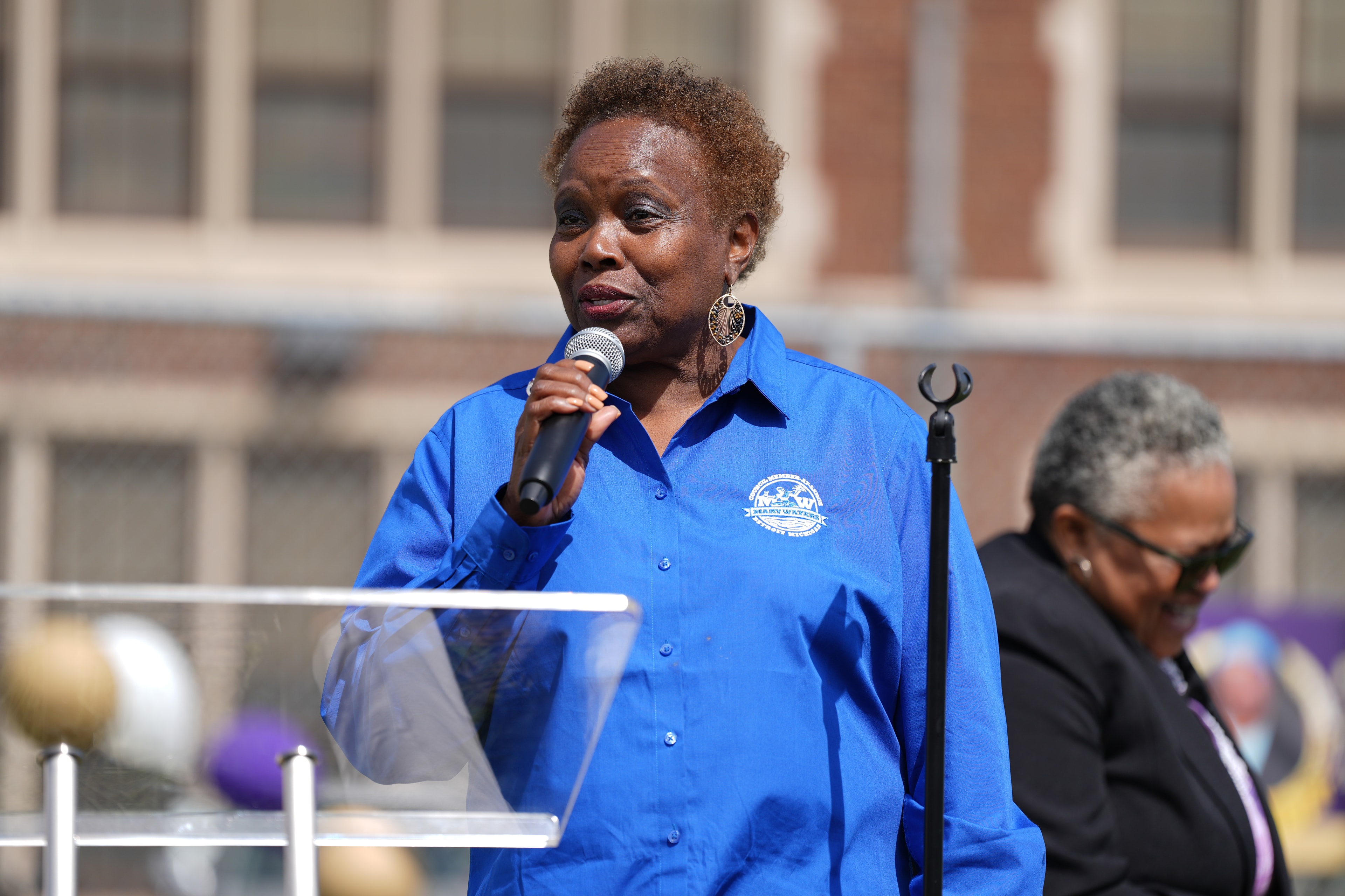 Woman speaking at outdoor public event
