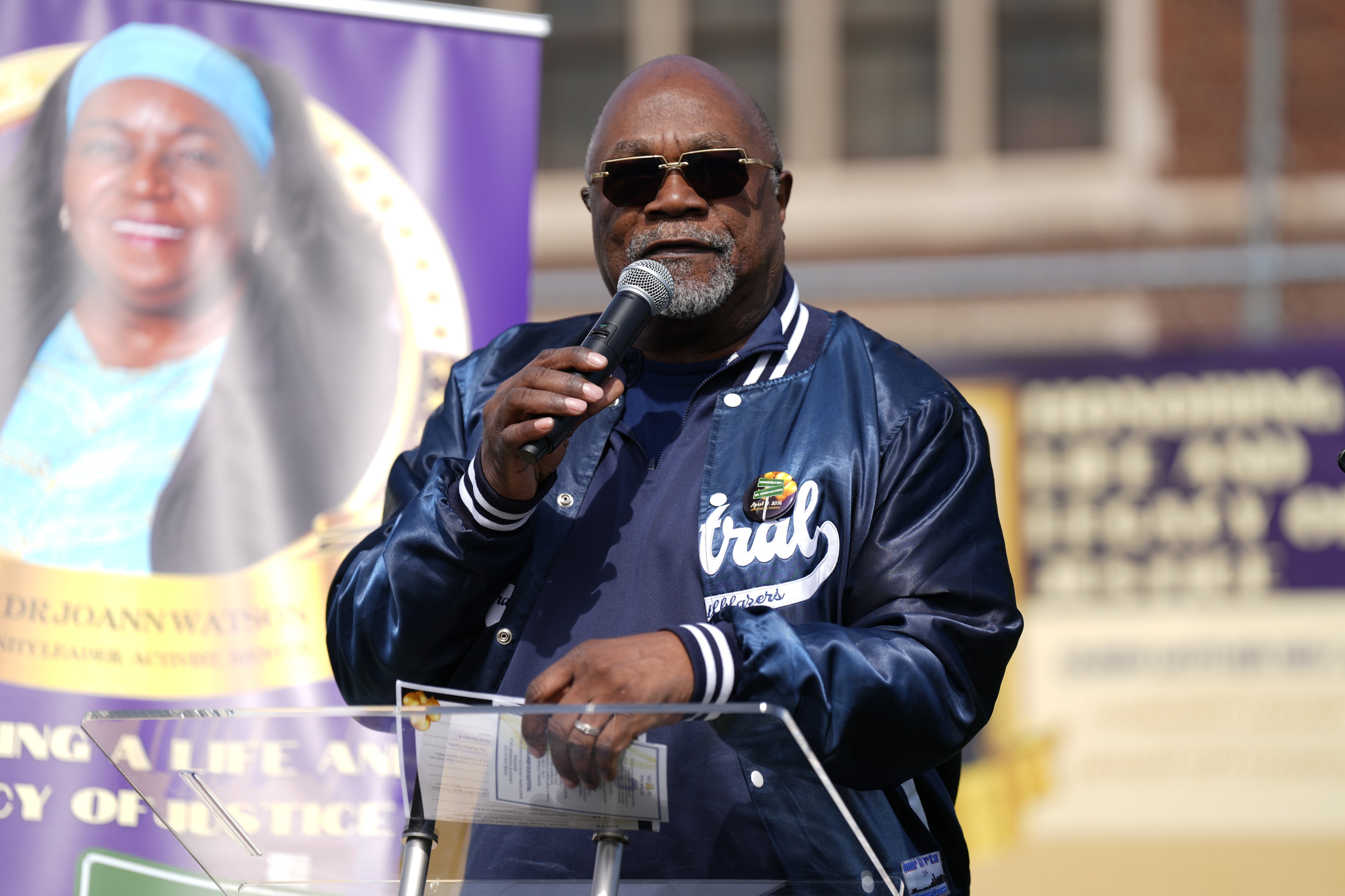 Man speaking at outdoor event microphone