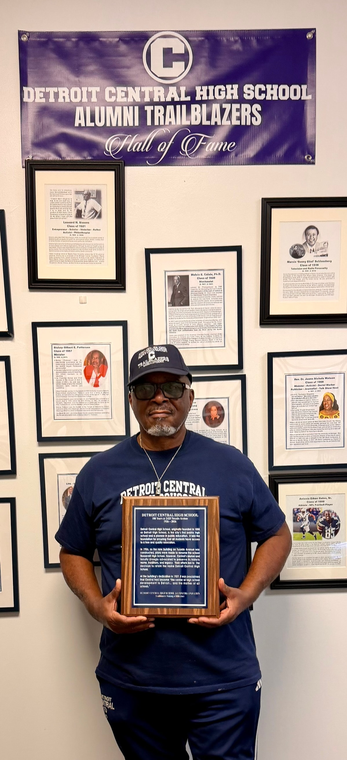 Man holding award Detroit Central High School