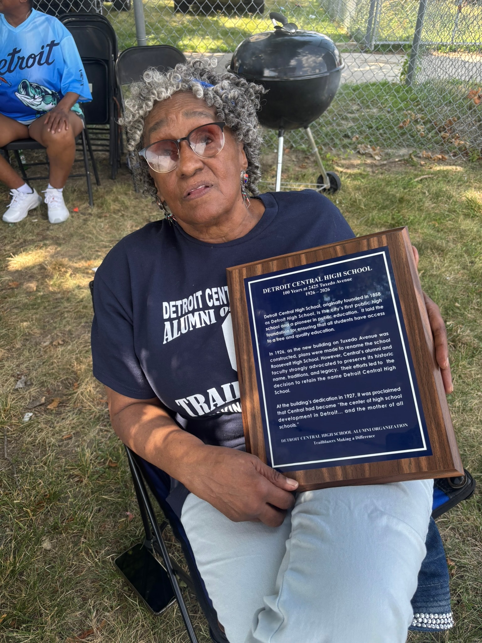 Detroit Central High School alumni holding plaque