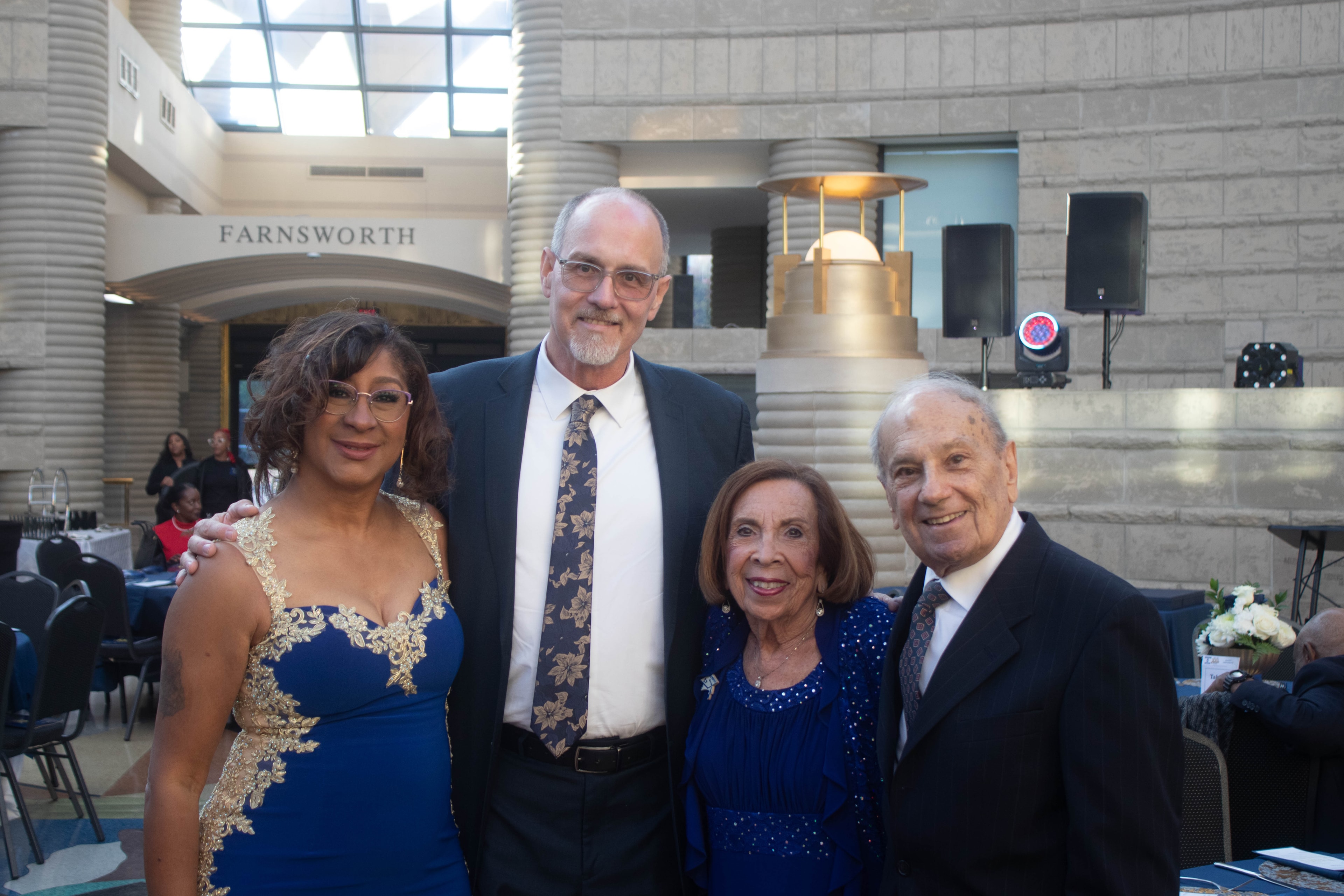 Four people posing at formal event Farnsworth