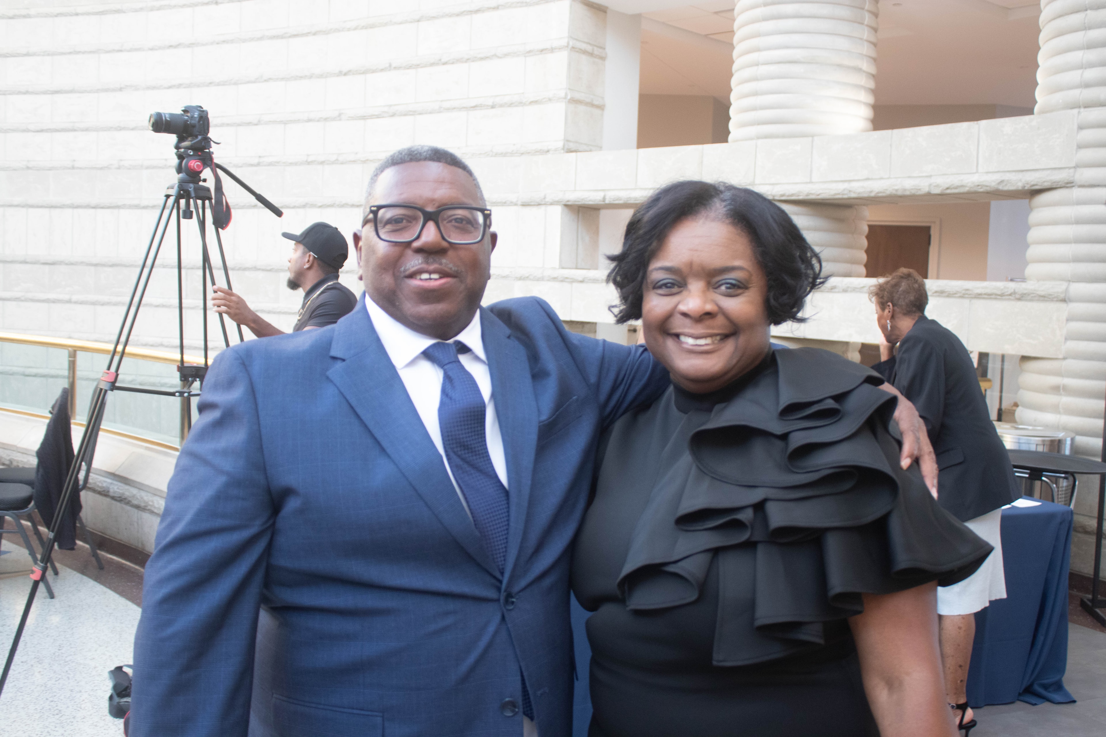 Two professionals posing government building event