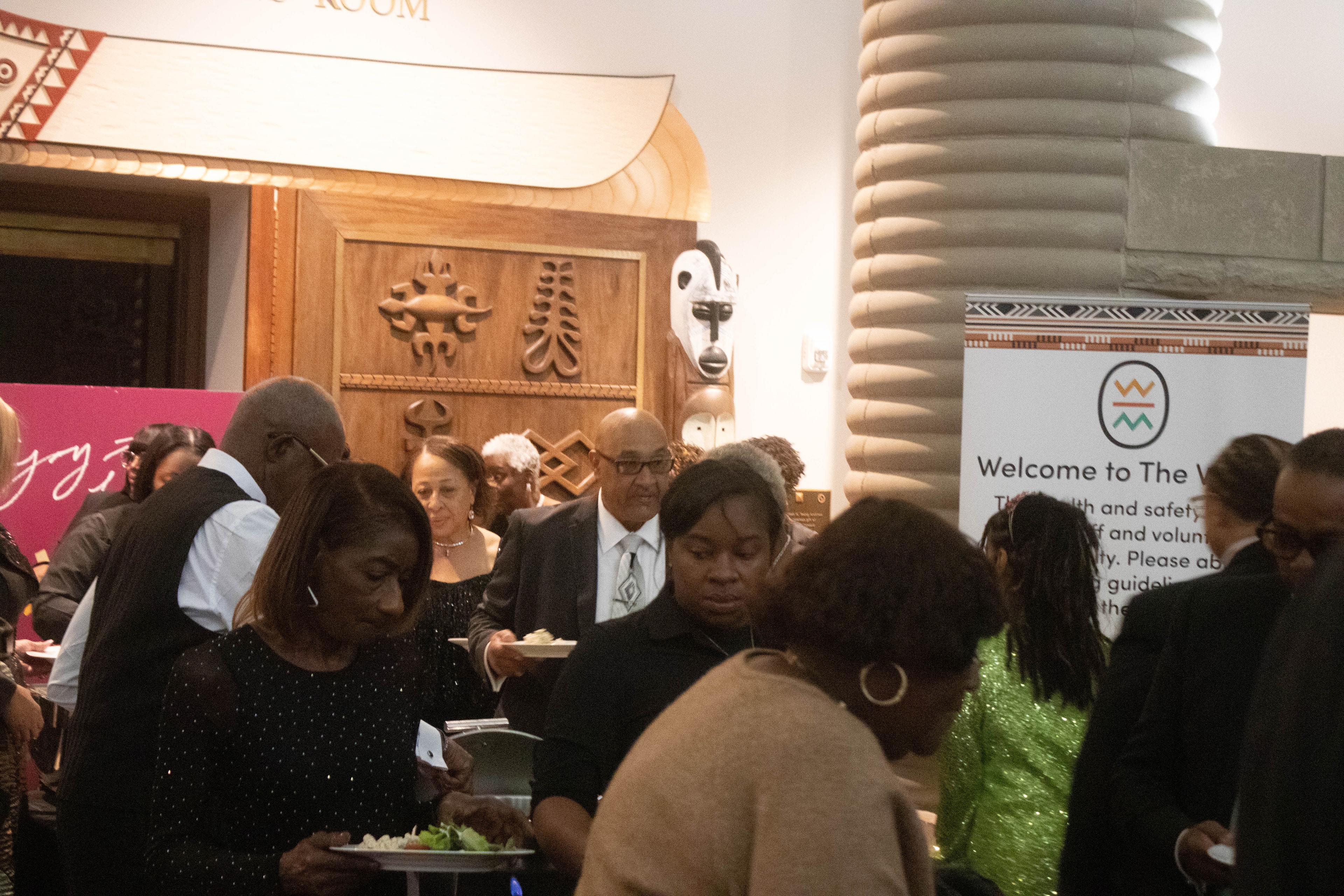 People gathering at formal indoor event reception
