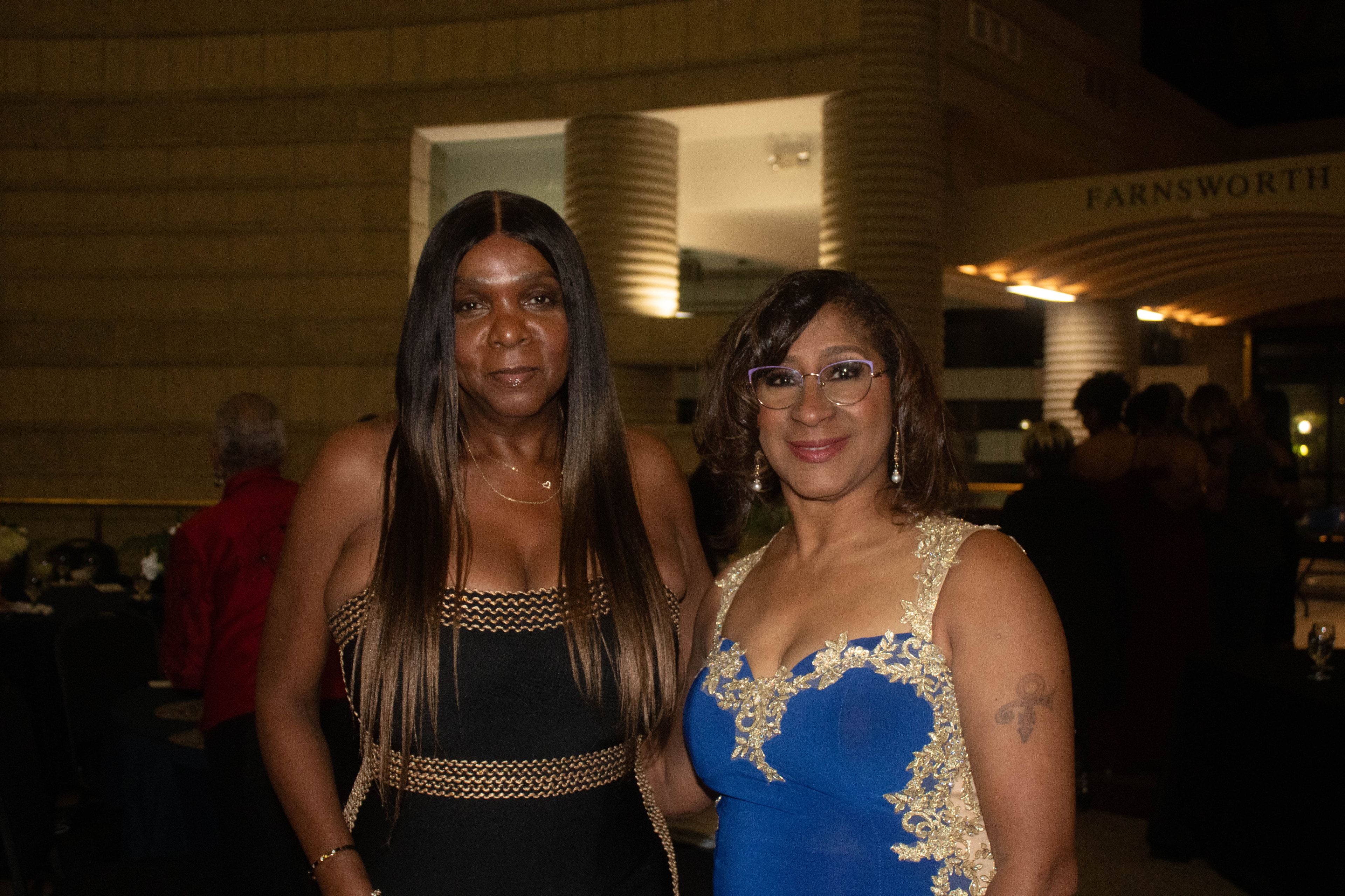 Two women in formal attire at event