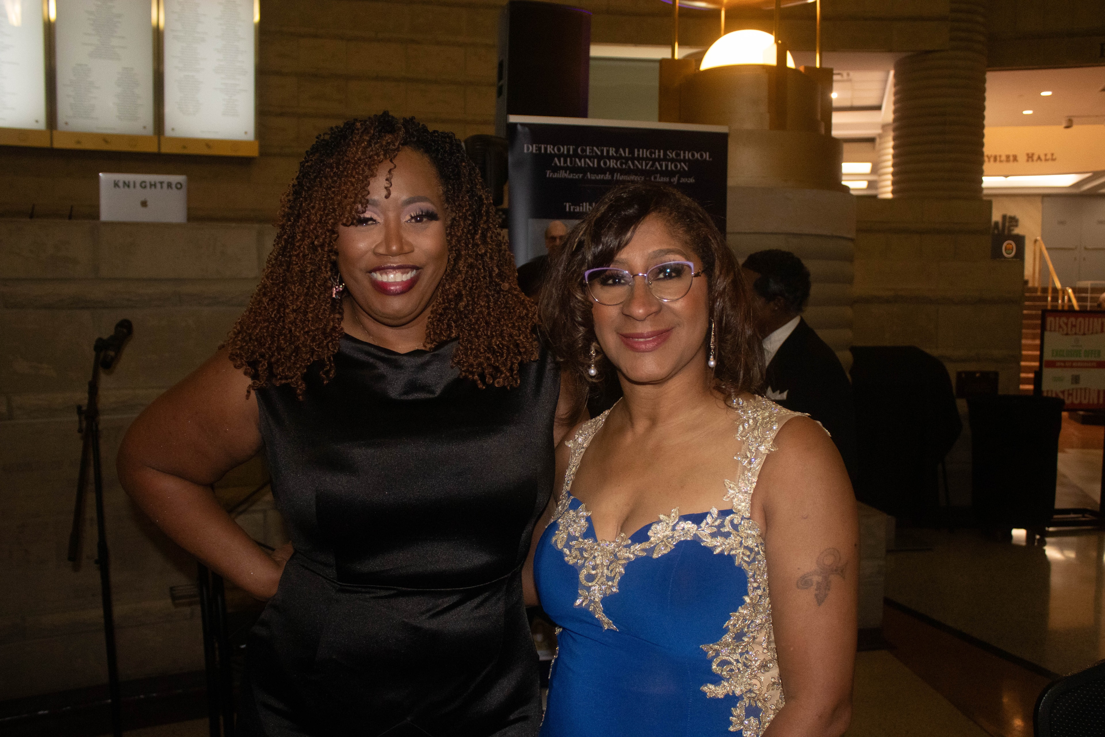 Two women posing at formal event