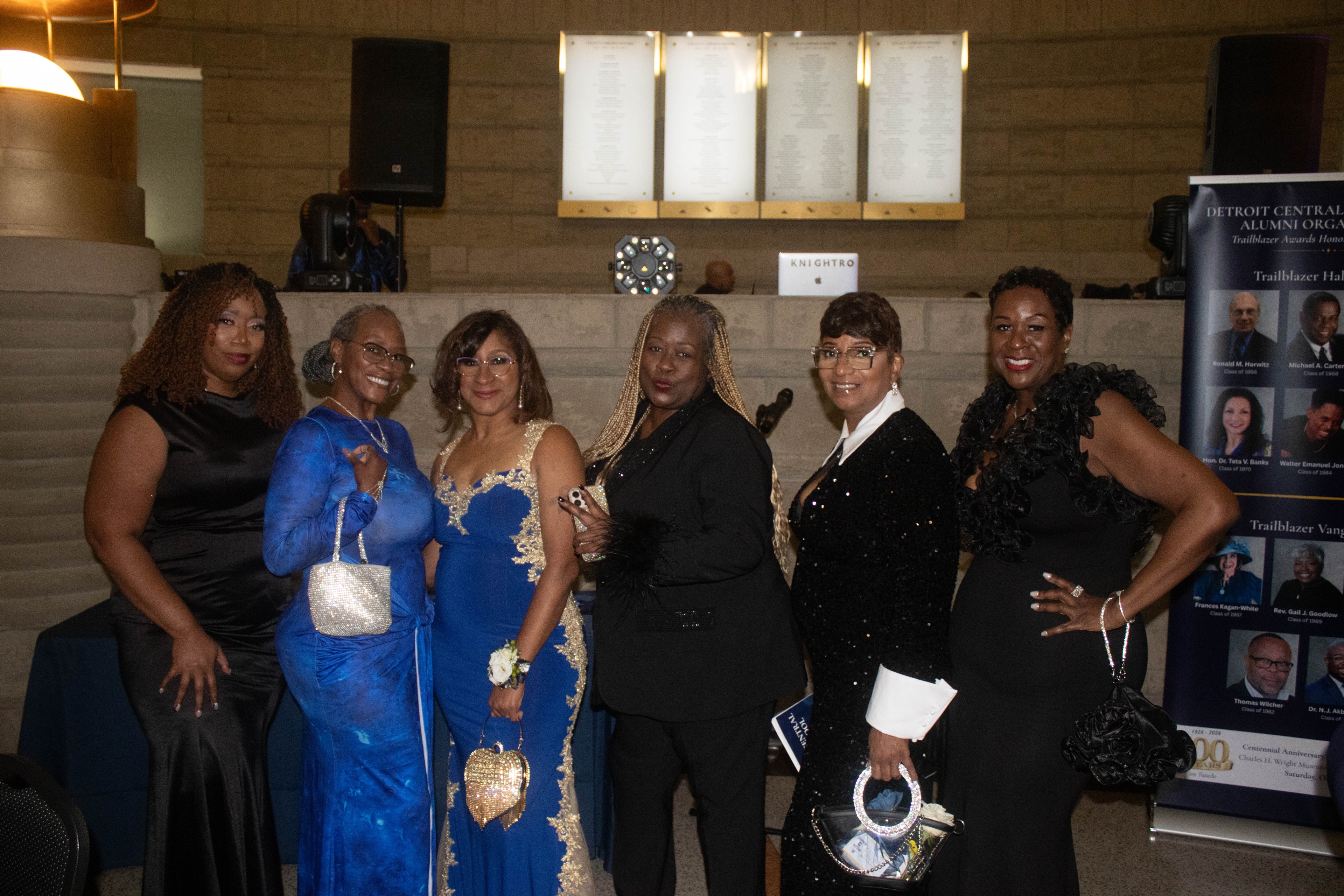 Six women in formal attire at event